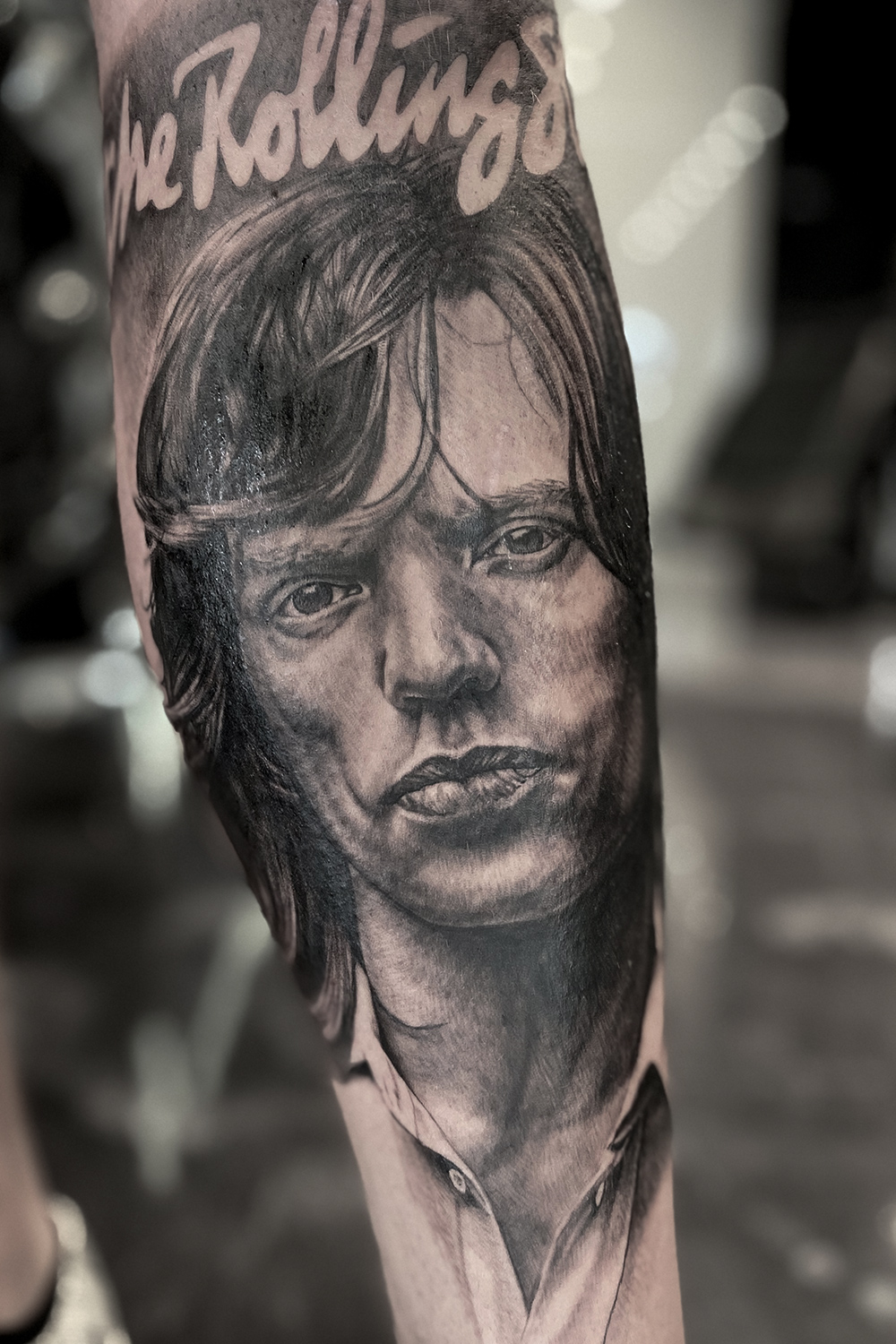 Mick Jagger portrait tattoo done on shin