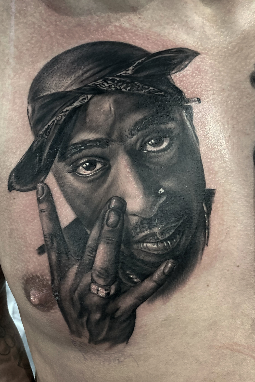 Portrait tattoo of 2Pac, hip hop icon